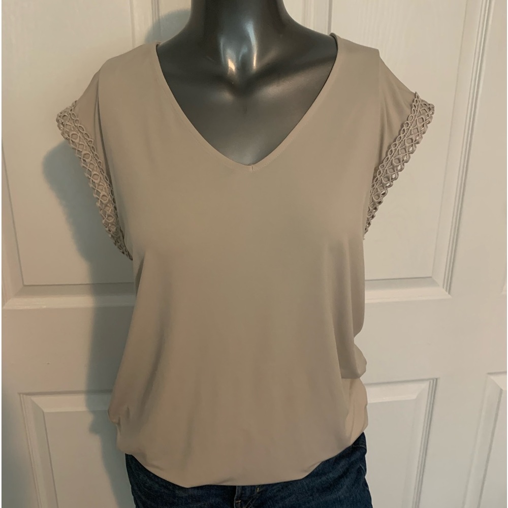 Short sleeve top with elastic around waist. Size s. Taupe